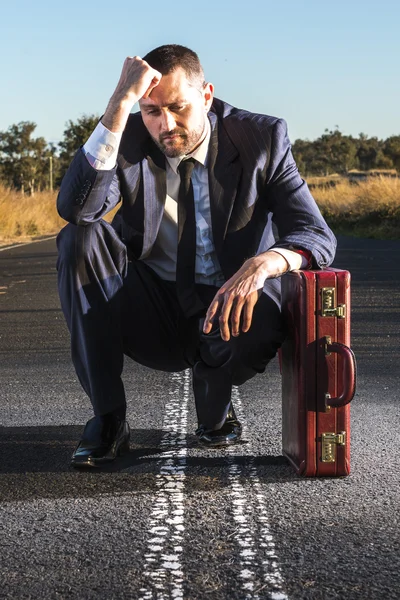Frustrated businessman in the outback