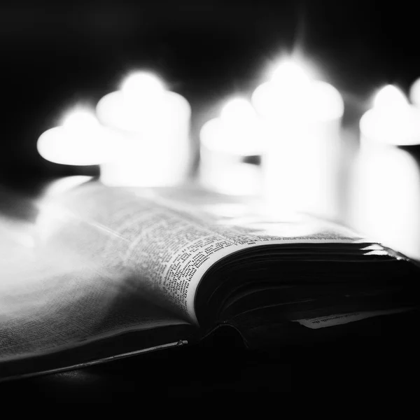 Bible with candles — Stock Photo, Image