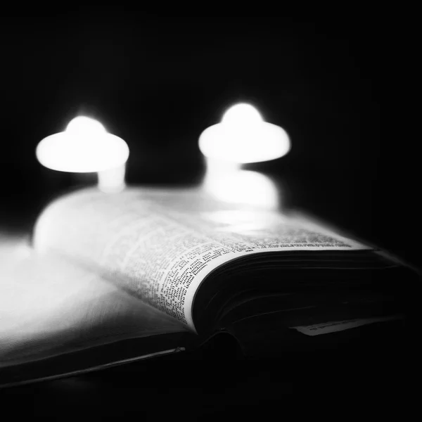 Bible with candles — Stock Photo, Image