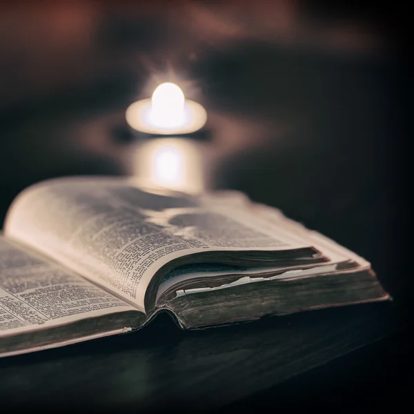 Bible with candles — Stock Photo, Image