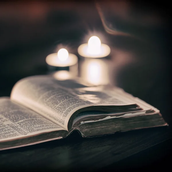 Bible with candles — Stock Photo, Image