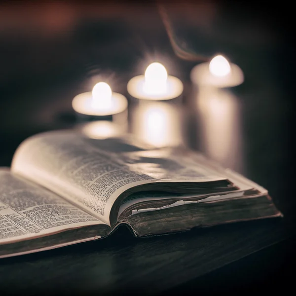 Bible with candles — Stock Photo, Image