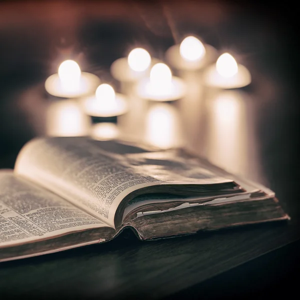 Bible with candles — Stock Photo, Image