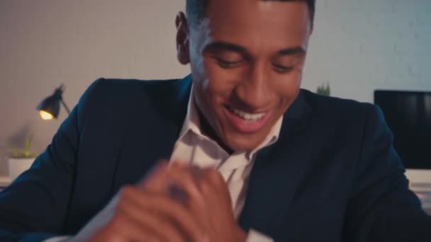 Joyful African American Businessman Rubbing Hands Eating Donut Office — Stock video