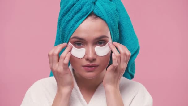 Young Woman Towel Head Taking Eye Patches Isolated Pink — Stock Video