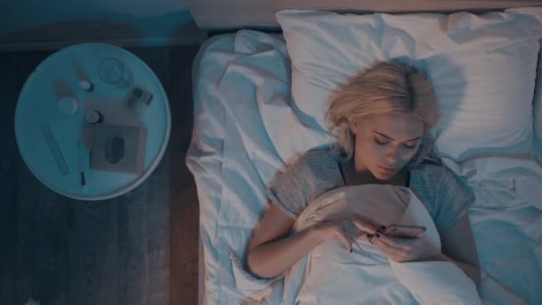 Top View Woman Using Smartphone While Lying Bed Bedside Table — Stock Video