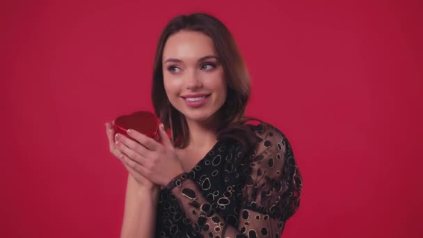 Happy Woman Black Dress Holding Heart Shaped Box Isolated Red — Stock Video