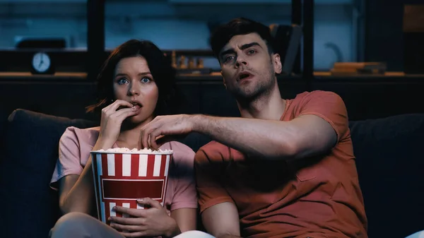 Man Reaching Popcorn Bucket Watching Movie Girlfriend — Stock Photo, Image