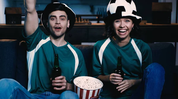 Cheerful Football Fans Fan Hats Holding Bottles Beer Rejoicing While — Stock Photo, Image