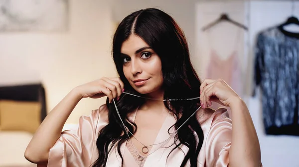 Smiling Brunette Young Woman Long Trying Necklace Bedroom — Stock Photo, Image