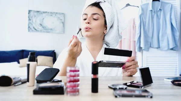 Young Woman Bathrobe Blowing Cosmetic Brush Table Decorative Cosmetics Bedroom — Stock Photo, Image