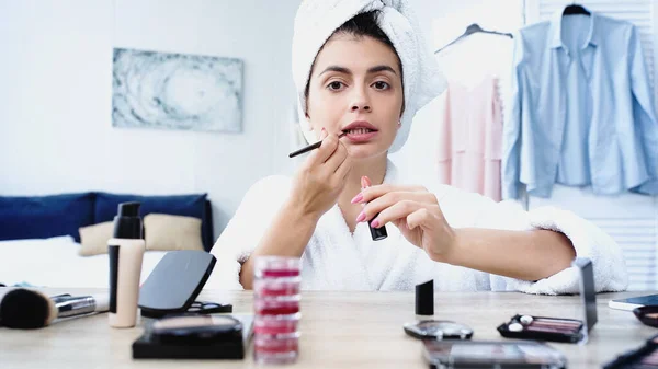 Young Woman Head Wrapped Towel Applying Lipstick Cosmetic Brush Bedroom — Stock Photo, Image