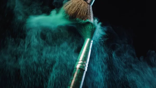 Two Cosmetic Brushes Making Splashes Turquoise Dust Black Background — Stock Photo, Image