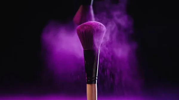 Soft Cosmetic Brushes Holi Paint Purple Splash Dust Black Background — Stock Photo, Image