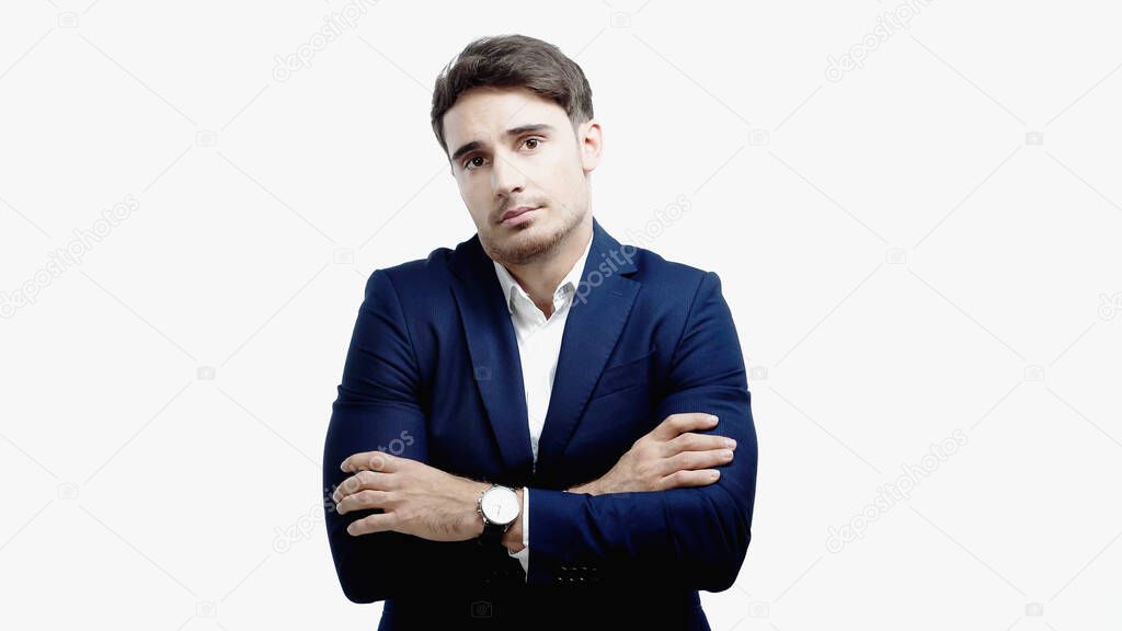 Confused manager in suit looking at camera isolated on white 