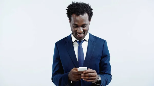 Smiling African American Businessman Messaging Cellphone Isolated Blue — Stock Photo, Image