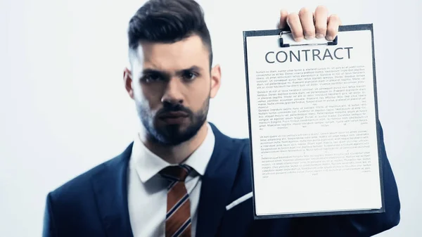 Blurred Businessman Looking Camera While Showing Contract Isolated White — Stock Photo, Image