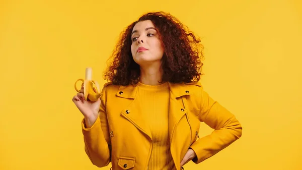 Young Curly Woman Leather Jacket Holding Ripe Banana While Standing — Stock Photo, Image