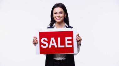 Smiling agent holding signboard with sale lettering isolated on white clipart