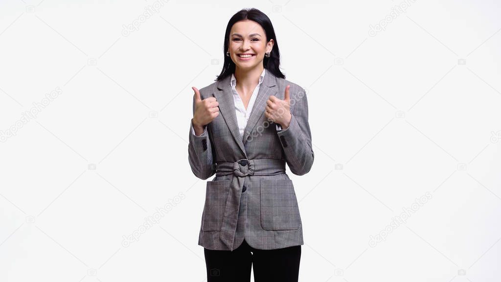 Smiling manager in formal wear showing thumbs up isolated on white