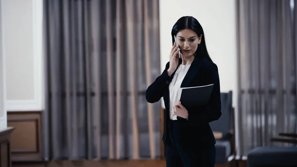Businesswoman Paper Folder Talking Mobile Phone Lobby Restaurant — Stockfoto
