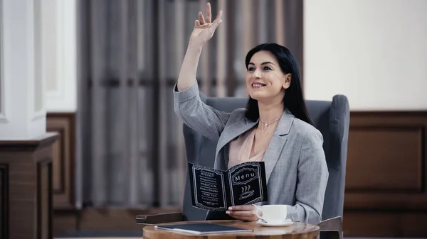 Cheerful Businesswoman Holding Menu Gesturing Lobby Restaurant — Φωτογραφία Αρχείου