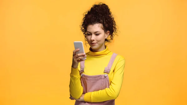 Positive Woman Curly Hair Chatting Smartphone Isolated Orange — Stock Photo, Image