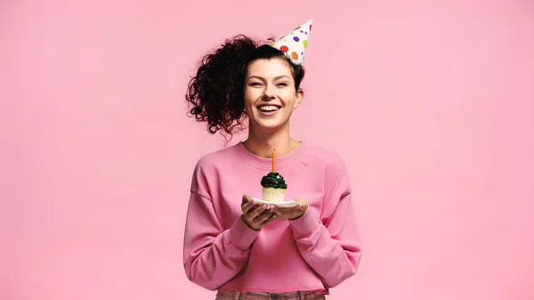 Cheerful Woman Party Cap Holding Birthday Cupcake Candle Isolated Pink — Stock Photo, Image