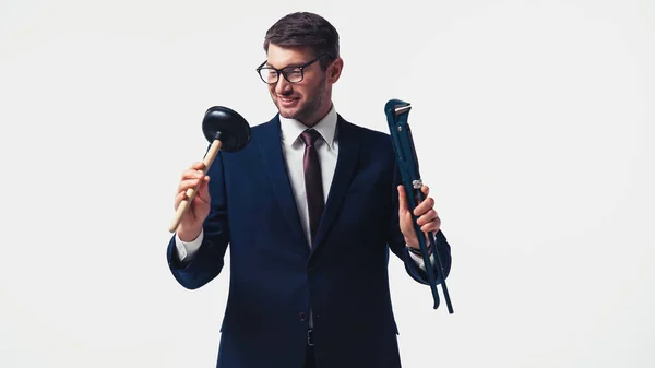Positive Businessman Suit Eyeglasses Holding Plunger Pipe Wrench Isolated White — Stock Photo, Image