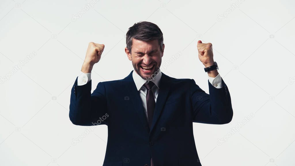 Businessman with closed eyes showing yes gesture isolated on white