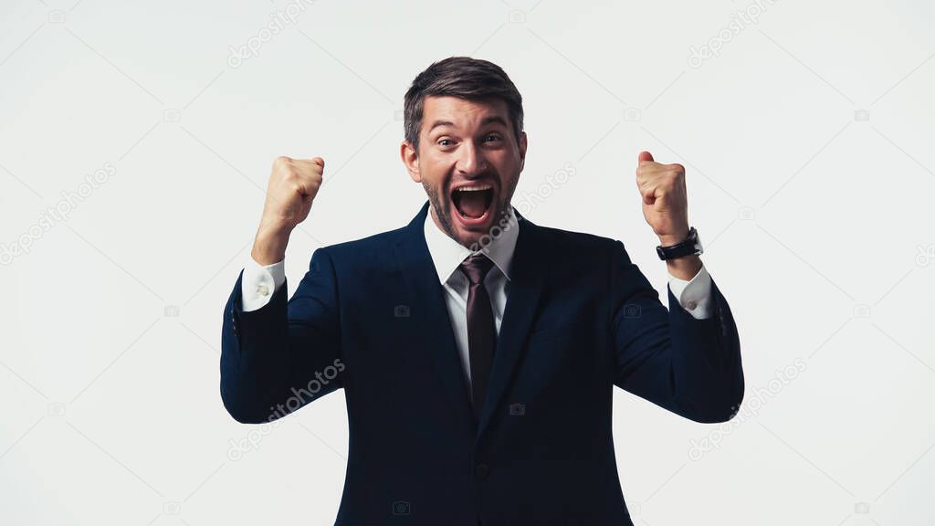 Excited manager with open mouth showing yes gesture isolated on white