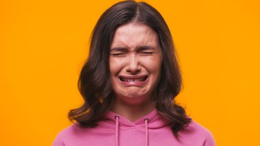 frustrated woman crying isolated on yellow clipart