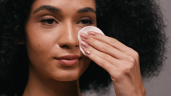 Close African American Woman Wiping Face Cotton Pad Isolated Grey — Stock Photo, Image