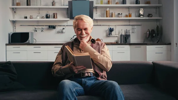 Positive Senior Man Reading Book Home — Stock Photo, Image