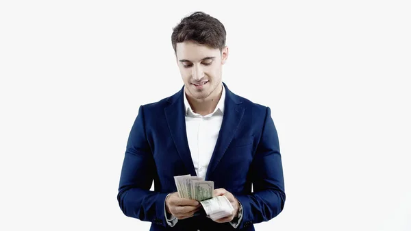 Un homme d'affaires prospère compte les dollars isolés sur blanc — Photo de stock