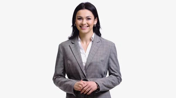 Brunette businesswoman smiling at camera isolated on white — Stock Photo