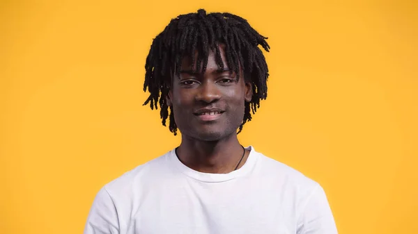Happy happy african american man with dreadlocks isolated on yellow — Stock Photo