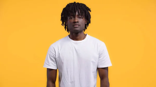 Young african american man with dreadlocks isolated on yellow — Stock Photo