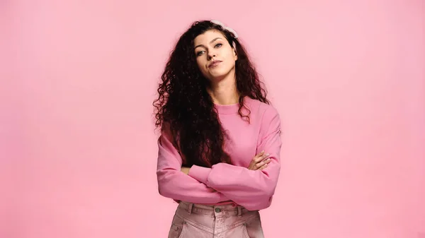 Haughty and displeased woman looking at camera isolated on pink — Stock Photo