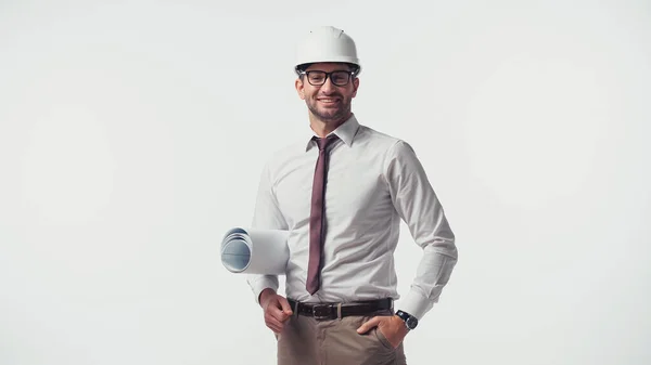 Smiling engineer with blueprint looking at camera isolated on white — Stock Photo