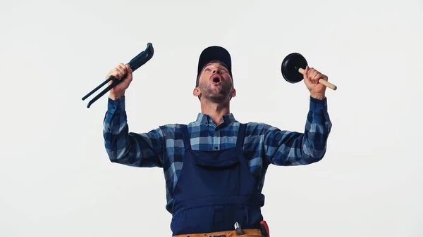 Excited handyman holding tools isolated on white — Stock Photo