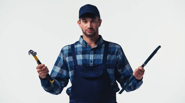 Repairman in overalls holding tools isolated on white — Stock Photo