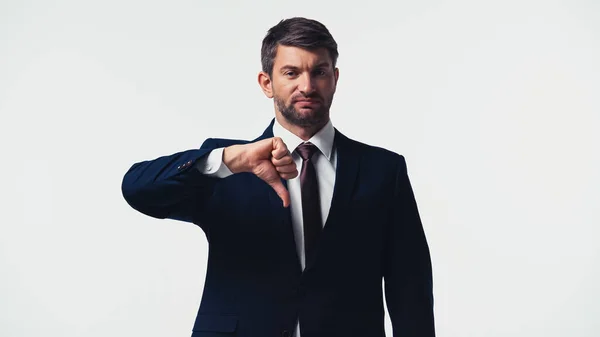 Uomo d'affari in giacca e cravatta mostrando antipatia isolato su bianco — Foto stock
