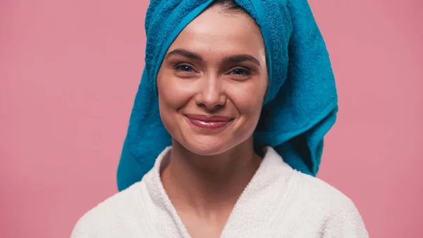 Young and happy woman with perfect skin looking at camera isolated on pink — Stock Photo