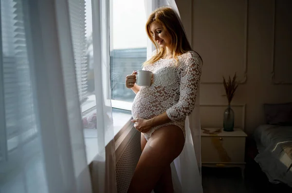 Mujer Embarazada Tocando Hermoso Vientre Cerca Ventana —  Fotos de Stock