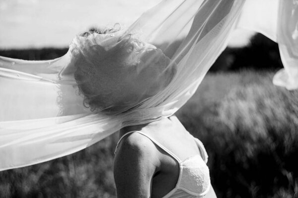 Free Sexy Caucasian Woman In White Underwear Enjoing In Field, Her hair fluttering in the wind.
