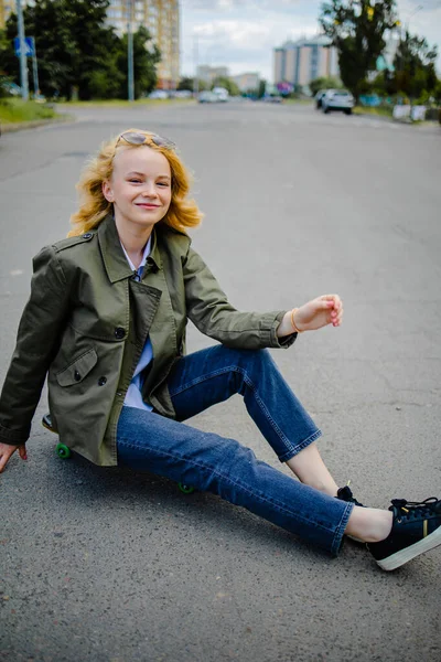 Smiling Teenage Girl Riding Skate Stock Photo