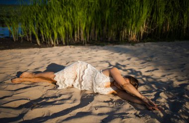 Happy Adult Woman Lay Donw On The Sand Beach Enjoying Summer Sun And Holiday