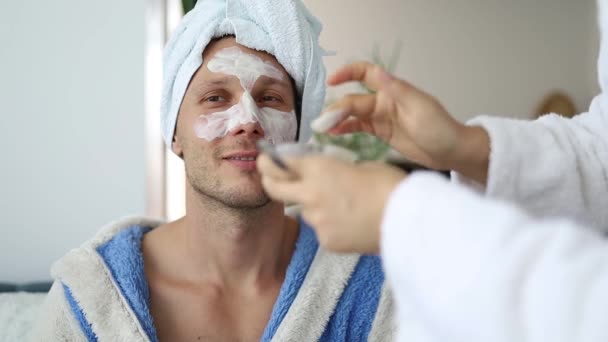 Happy Joyful Couple Bathrobe Beauty Mask Making Wellness Home — Stock Video