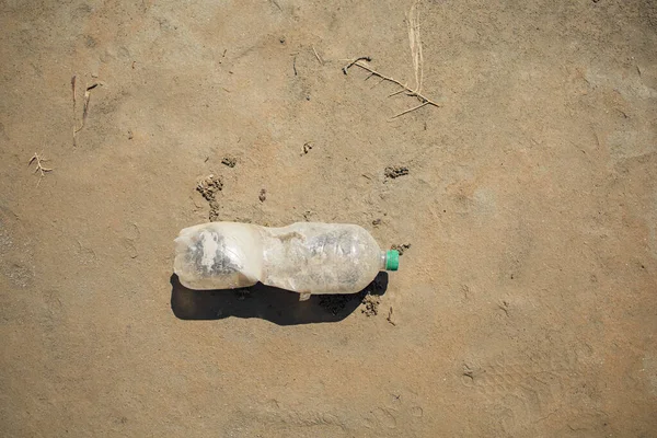 Pollution of plastic water bottle in the ocean, environmental concept.